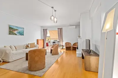 a living room with a couch and a tv at Athens Acropolis Apartment in Athens
