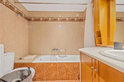 a bathroom with a tub and a sink at Athens Acropolis Apartment in Athens