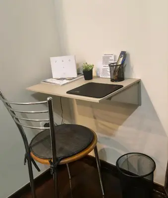 a desk with a chair and a laptop on it at Piraeus City Center Apartment Port & Metro Dimotiko theatro in Piraeus
