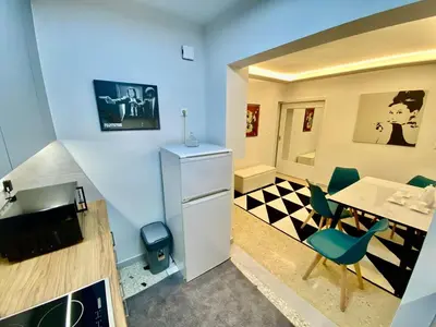 a kitchen with a table and a dining room at 4 Cups of Mint Tea in Athens