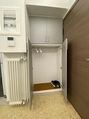 a walk in closet with a cupboard and a door at 4 Cups of Mint Tea in Athens