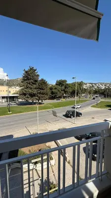 a balcony with a view of a parking lot at Retro Chic 1 BR 1 Min to Sea in Athens