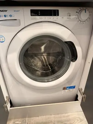 a white washing machine with its door open at Pagrati Luxury Gray Studio-Chremonidou street in Athens