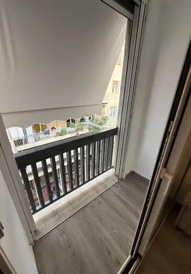 a view from the top of a balcony with a window at Pagrati Luxury Gray Studio-Chremonidou street in Athens