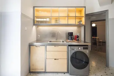 a kitchen with a sink and a washing machine at Amazing flat just 500 m from Acropolis museum in Athens
