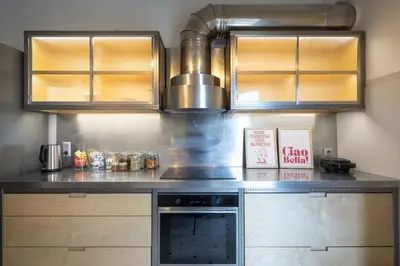 a kitchen with a counter top with a stove at Amazing flat just 500 m from Acropolis museum in Athens