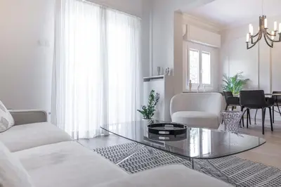 a living room with a couch and a table at Adorac in Athens