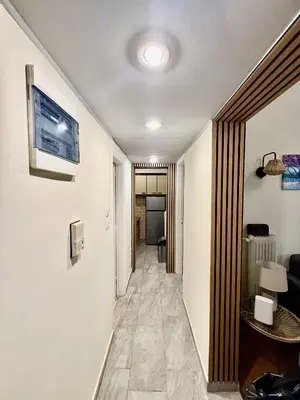 a hallway leading to a room with a hallway at Near Acropolis-Athens in Athens