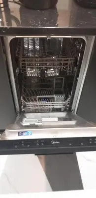 an open oven with its racks in it at Flouris Apartments in Athens