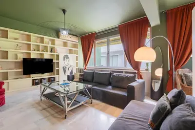 a living room with a couch and a table at Athens' Pearl in Athens