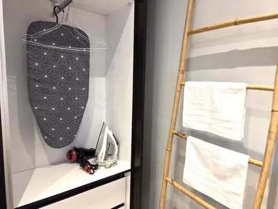 a room with a ladder and a bag on a shelf at Georgette's Charming Studio near Metro by MPS in Athens