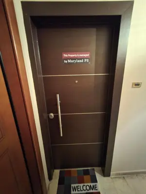 a door with a sign on it in a hallway at Georgette's Charming Studio near Metro by MPS in Athens