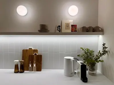 a kitchen counter with two lights on a shelf at Quaint & Central Acropolis apartment in Athens