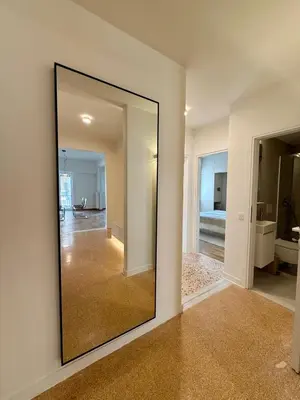 a large mirror on a wall in a room at Quaint & Central Acropolis apartment in Athens