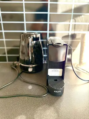 a blender and a phone sitting on a counter at Delightful Seaside & Romantic in Athens