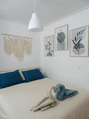 a bedroom with a bed with two stuffed animals on it at Secret Nest in Athens