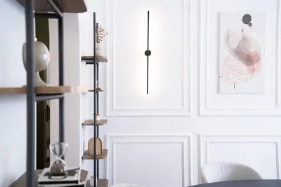 a dining room with white walls and a table at Plaka Elegance Retreat in Athens
