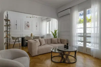a living room with a couch and a table at Plaka Elegance Retreat in Athens