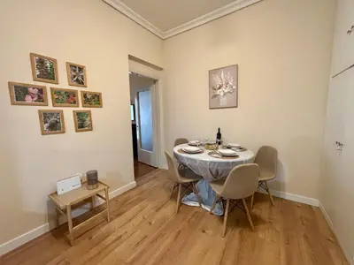 a dining room with a table and chairs in a room at Casa Philoxenia, Acropolis District in Athens
