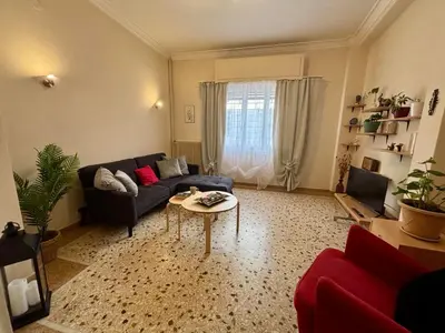 a living room with a couch and a table at Casa Philoxenia, Acropolis District in Athens