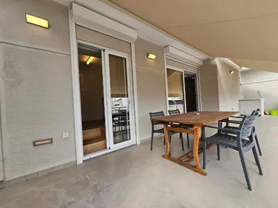 a dining room with a wooden table and chairs at Skynest Studio byYHA in Athens