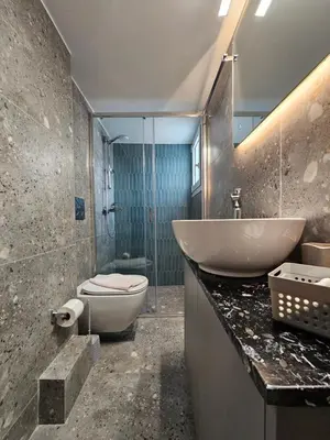 a bathroom with a sink and a toilet at Skynest Studio byYHA in Athens