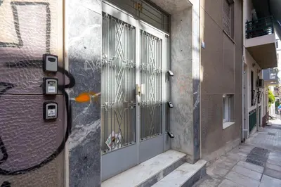 an open door of a building with a dog in it at Aminandrou Boutique Apartments, Walk to Acropolis in Athens