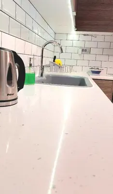 a kitchen counter top with a sink and a sink at Vouliagmeni Top Floor Maisonette in Athens