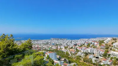 a view of a city with the ocean in the background at Voula Hill Panoramic Views of Sea and Athens 129 sqm 2 bedrooms 2 bathrooms Big Fully Equipped New Apartment Peaceful in Athens