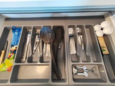 a drawer filled with utensils in a refrigerator at Voula Hill Panoramic Views of Sea and Athens 129 sqm 2 bedrooms 2 bathrooms Big Fully Equipped New Apartment Peaceful in Athens
