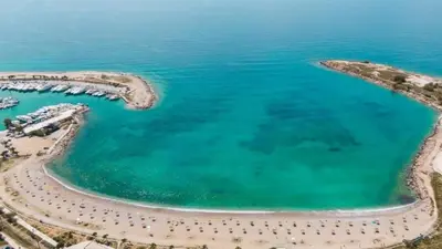 an aerial view of the beach and the ocean at Nafsika Cozy Flat A - Glyfada in Athens