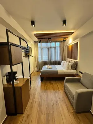 a hotel room with a bed and a couch at Acropolis View 301 By Pantheon Ermou in Athens