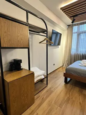 a bedroom with two bunk beds and a desk at Acropolis View 301 By Pantheon Ermou in Athens