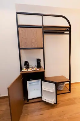 a room with a bunk bed with a refrigerator at Acropolis View 301 By Pantheon Ermou in Athens