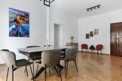 a dining room with a table and chairs at Cozyopolis - Timeless 3-BR Escape in Athens in Athens