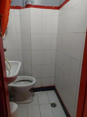 a bathroom with a toilet and a sink at ACROPOLI AND MONASTIRAKI HOMe1 in Athens