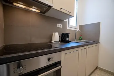 a small kitchen with a sink and a stove at Casa di Anna 1 bed 4 pers Apt by MPS in Athens