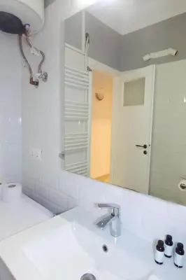 a bathroom with a sink and a mirror at Casa di Anna 1 bed 4 pers Apt by MPS in Athens