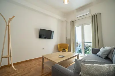 a living room with a couch and a table at Casa di Anna 1 bed 4 pers Apt by MPS in Athens