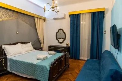 a bedroom with a bed with two towels on it at Athens King 1 in Athens