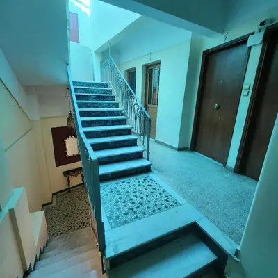 an empty staircase in a building with a door at Athens King 1 in Athens