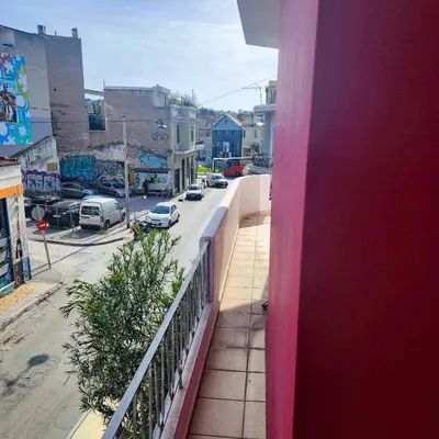 a balcony with a view of a street with cars at Athens King 1 in Athens