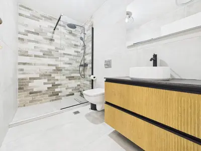 a bathroom with a sink and a toilet and a shower at KASO - Vresthenis - Acropolis View in Athens