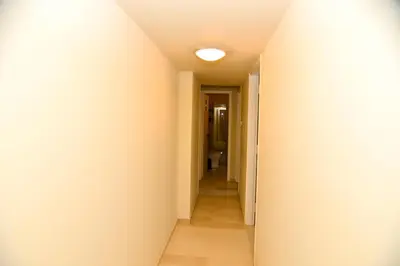 a corridor of a hallway with at Athens stylish apt 2 min walk to the beach , tram in Athens