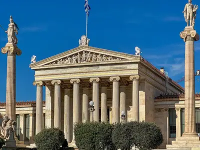 a building with a statue on top of it at Athens centre top floor stylish 2 min walk metro in Athens