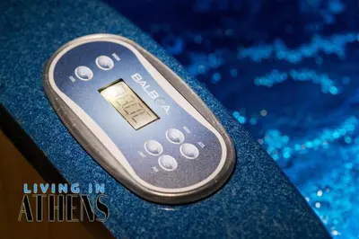a remote control sitting on top of a table at Eugene's Loft - Acropolis View - Jacuzzi 2&1 ppl in Athens