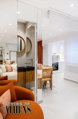 a living room with a couch and a kitchen at Eugene's Luxury Apt 2&1 ppl 3min Walking Distance to Metro Station in Athens