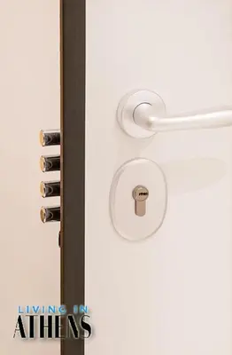 a door with a handle and a lock on it at Eugene's Luxury Apt 2&1 ppl 3min Walking Distance to Metro Station in Athens