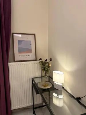 a room with a glass table with a lamp and a picture at Urban Luxy Staycation in Athens