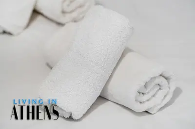 a roll of white towels sitting on a table at Spacious Familly Apt Next To Acropolis And Museum 4&1 in Athens